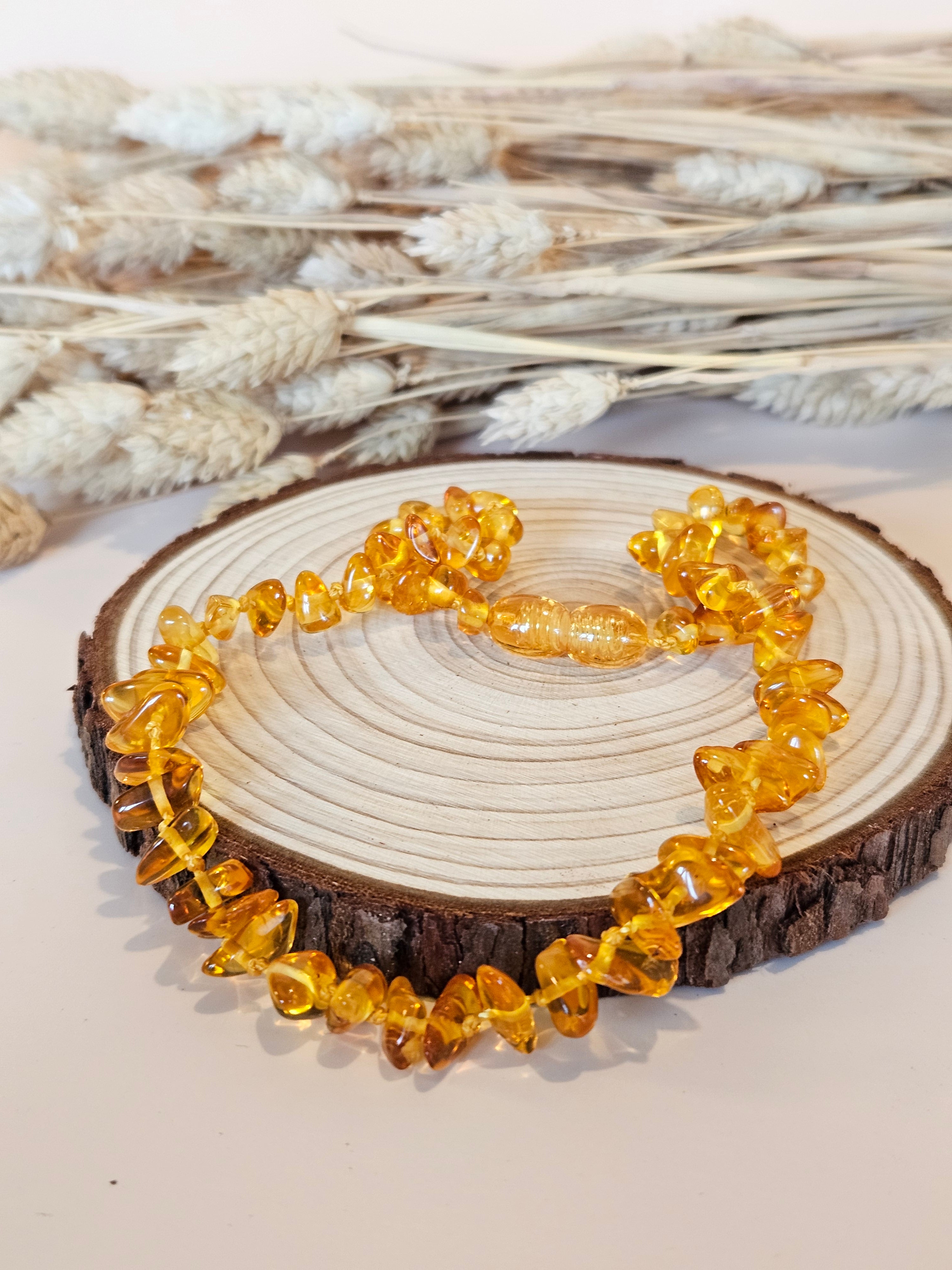 Collier de dentition ambre miel