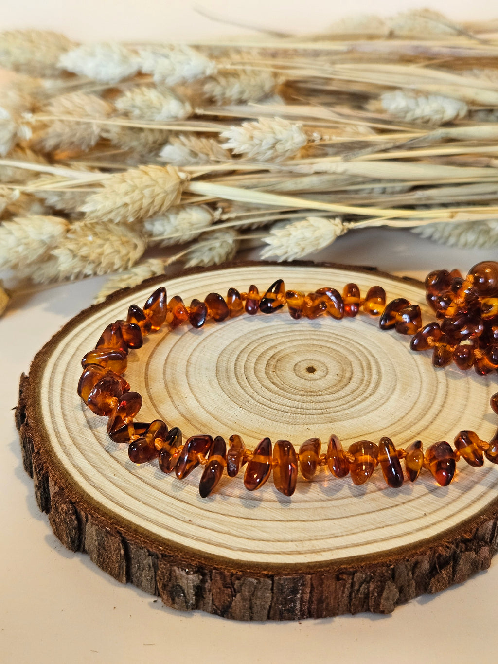 Collier de dentition ambre  cognac