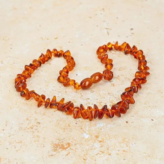 Collier de dentition ambre  cognac