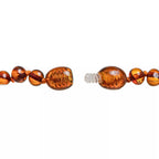 Collier de dentition ambre  cognac