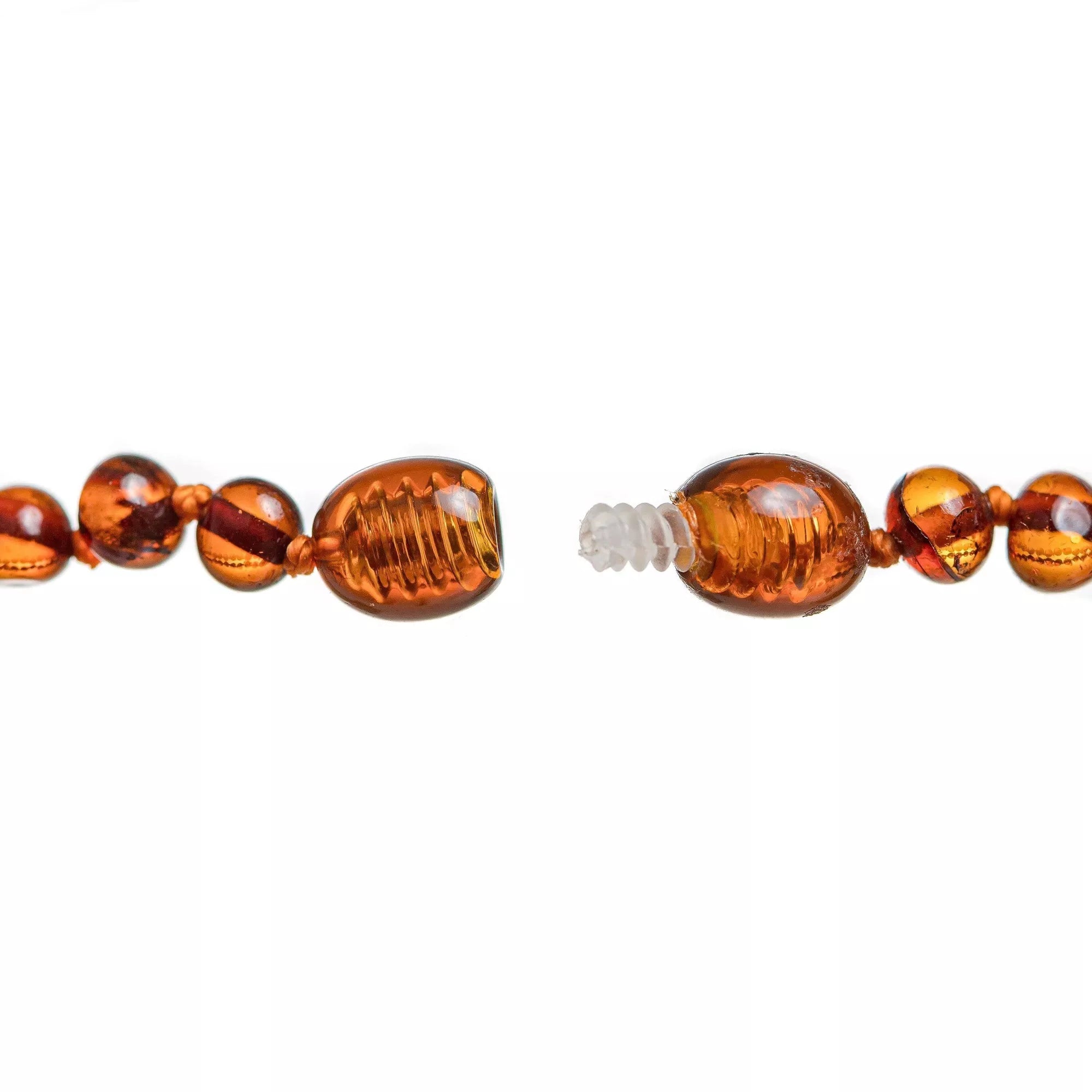 Collier de dentition ambre  cognac