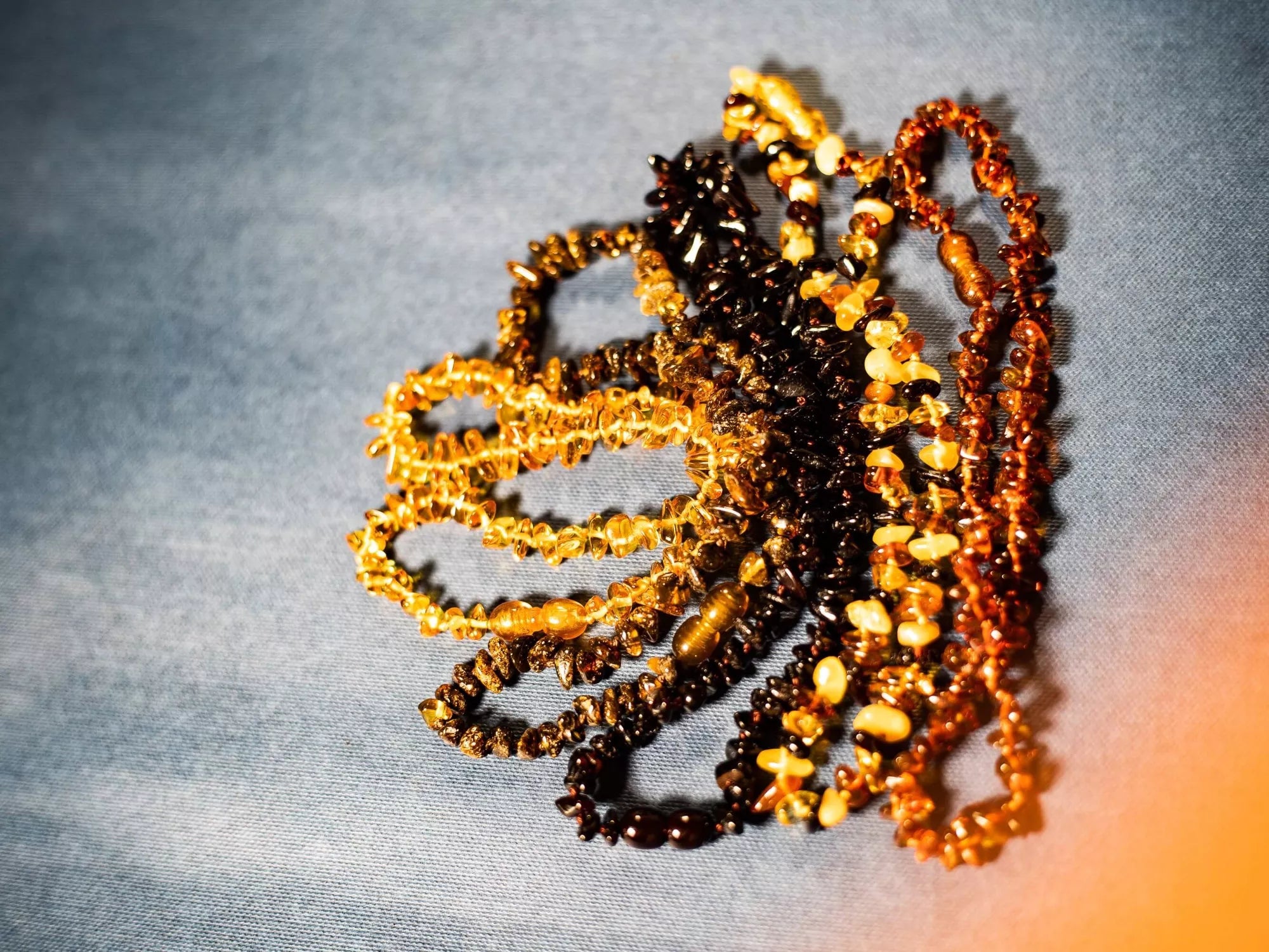 Collier de dentition ambre miel